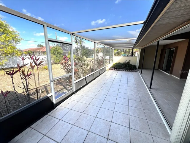 Screened lanai with garden area