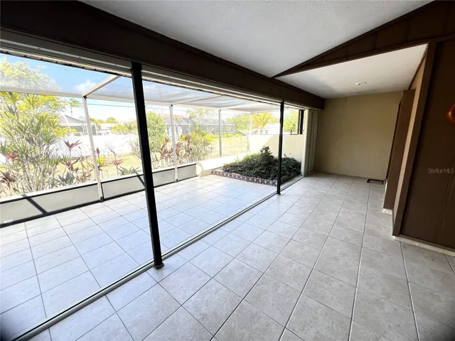 Screened lanai with garden area