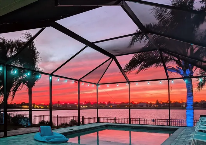Western sunset views while overlooking expansive pond