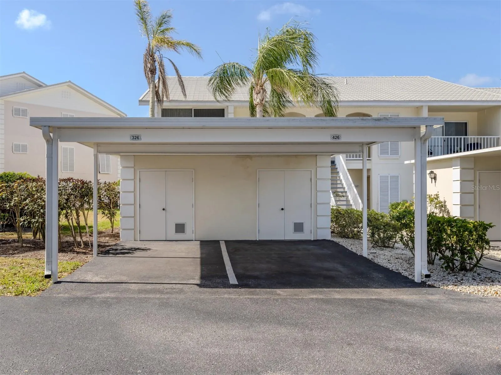The carport also includes a storage closet which is perfect for golf clubs or beach chairs