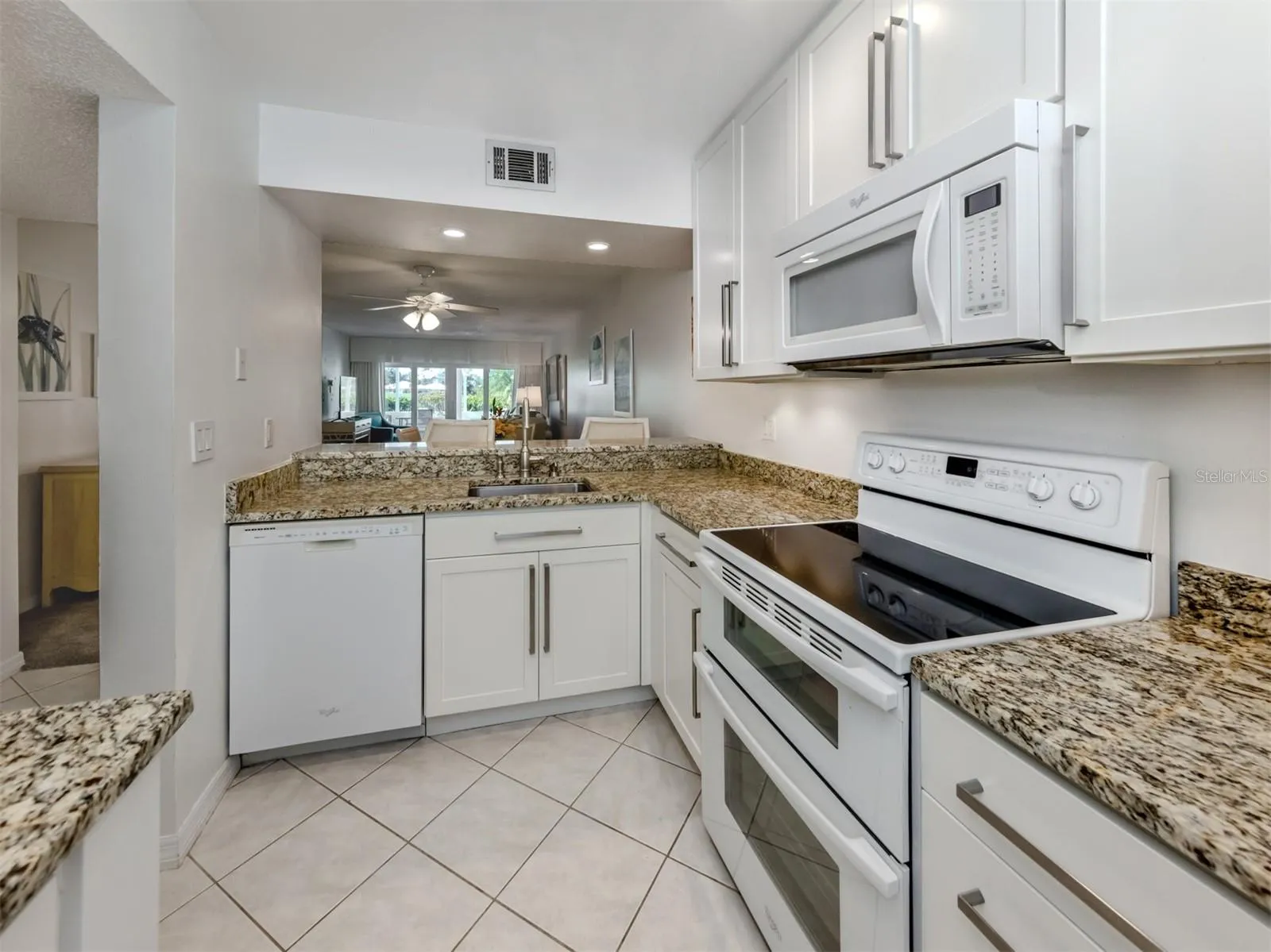 The kitchen includes a breakfast bar and over looks the great room design