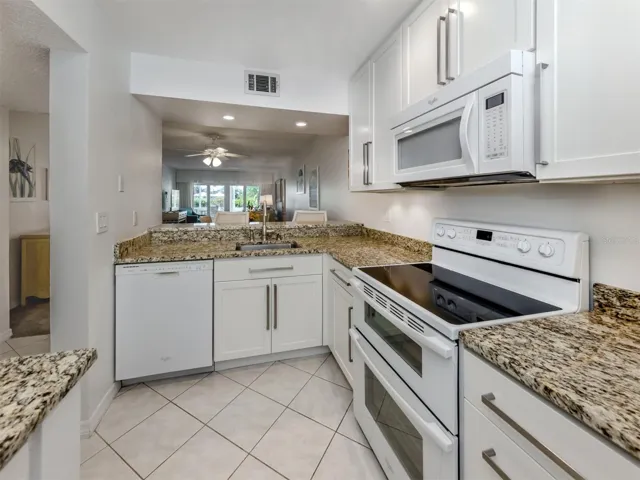 The kitchen includes a breakfast bar and over looks the great room design