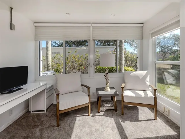 The master sunroom is sun filled and the perfect spot for a morning coffee or tea
