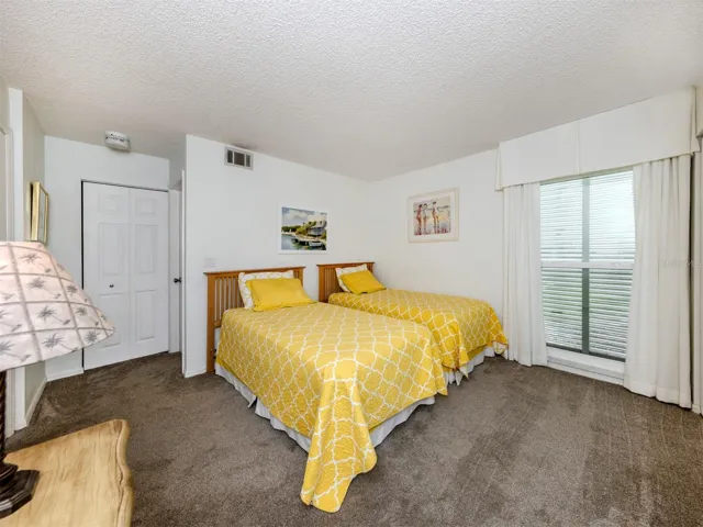 The guest room is just off the back of the the unit with beautiful views and sliding glass door access to the lanai
