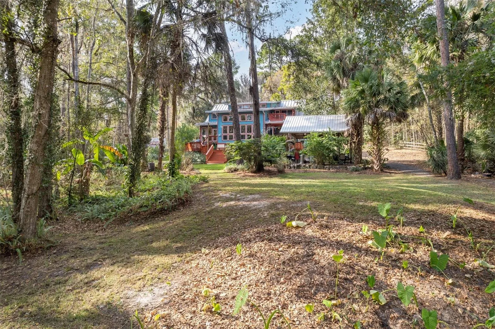 Back of property, view of home and cabana