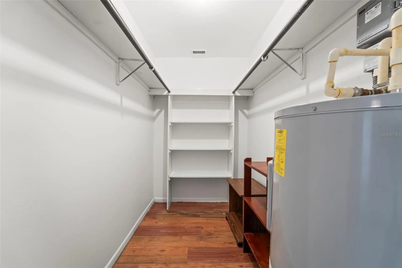 Primary bedroom walk in closet