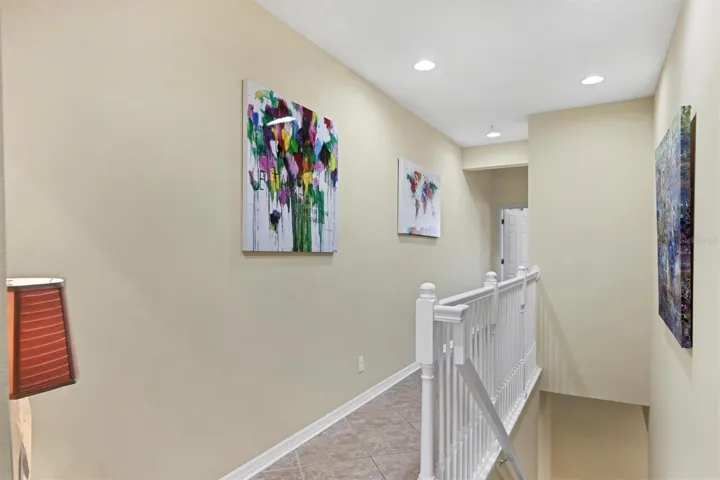 Stairs from garage to 2nd level of living space, hallway to bedrooms
