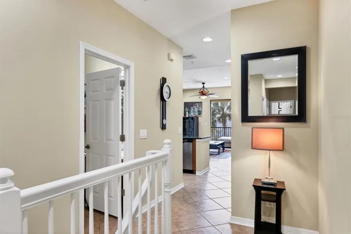 Stairs lead to the 2nd level of living space. Guest bath at top of stairs