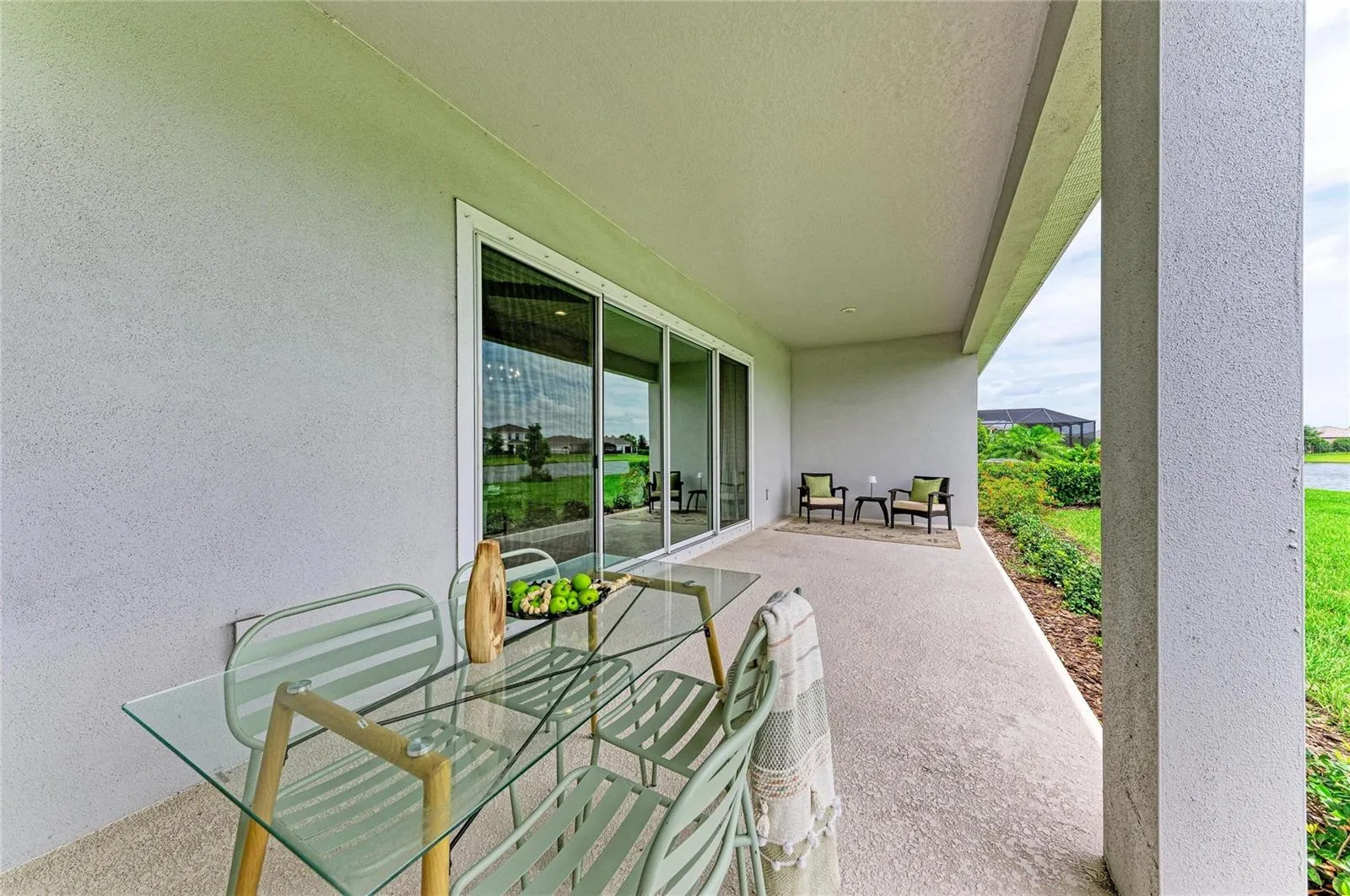 Covered outdoor living space designed for year-round Florida enjoyment