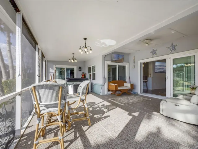 Step outside to the EXPANSIVE SCREENED and ENCLOSED REAR PATIO, where breathtaking pond views set the stage for morning coffee or evening sunsets.