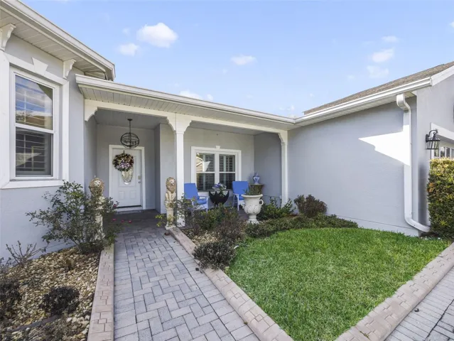From the moment you arrive, the home makes a statement with its paver driveway, walkway, and covered front porch, all framed by METICULOUS LANDSCAPING.
