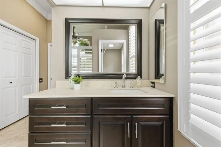 Remodeled primary suite with custom dual vanities.