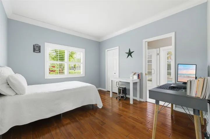 Guest bedroom 3 with private bathroom out to pool area.