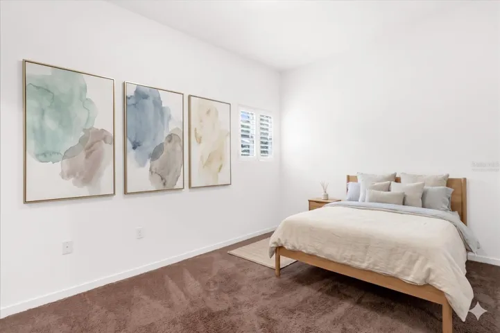 Virtually staged second bedroom with plenty of sunlight