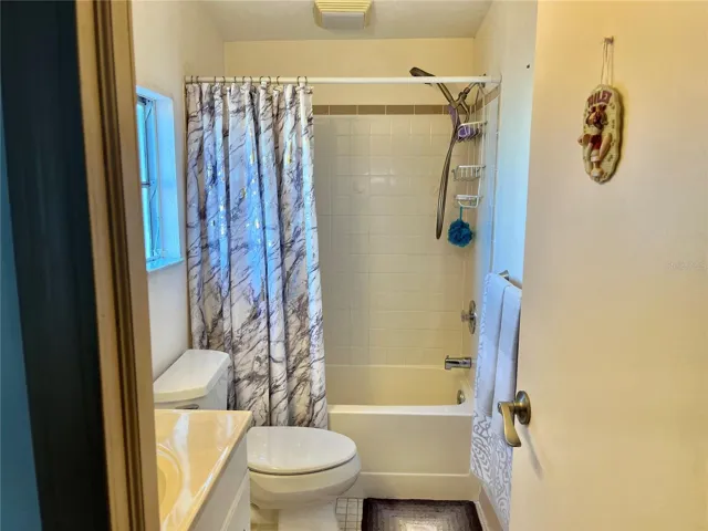 Bath with tub/shower enclosure
