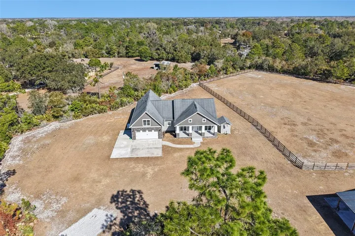 Custom built craftsman style home on 5 acre property zoned for horses with deed Lake Pickett access