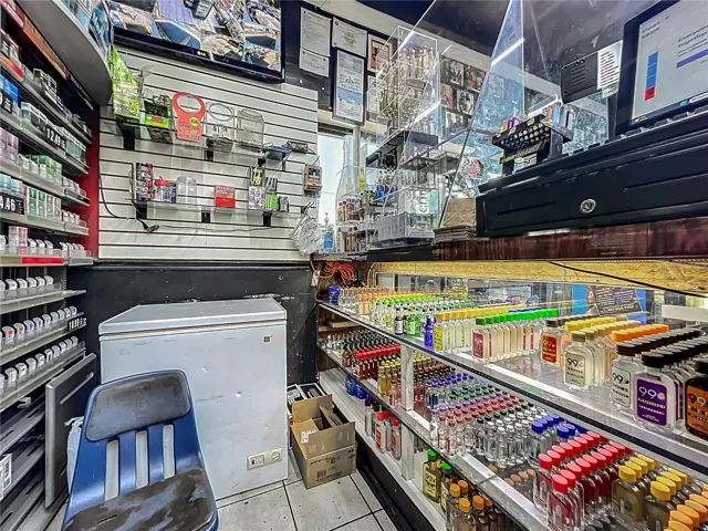 Main Glass-Enclosed Register with Front Counter Liquor Display