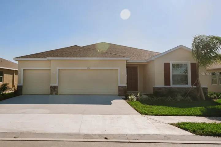 Frontal view of home with 4 bedroom and 3 car garage.