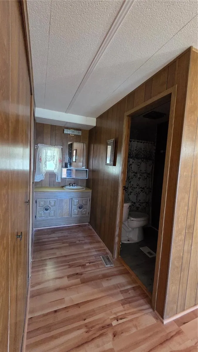Vanity and primary bathroom entrance