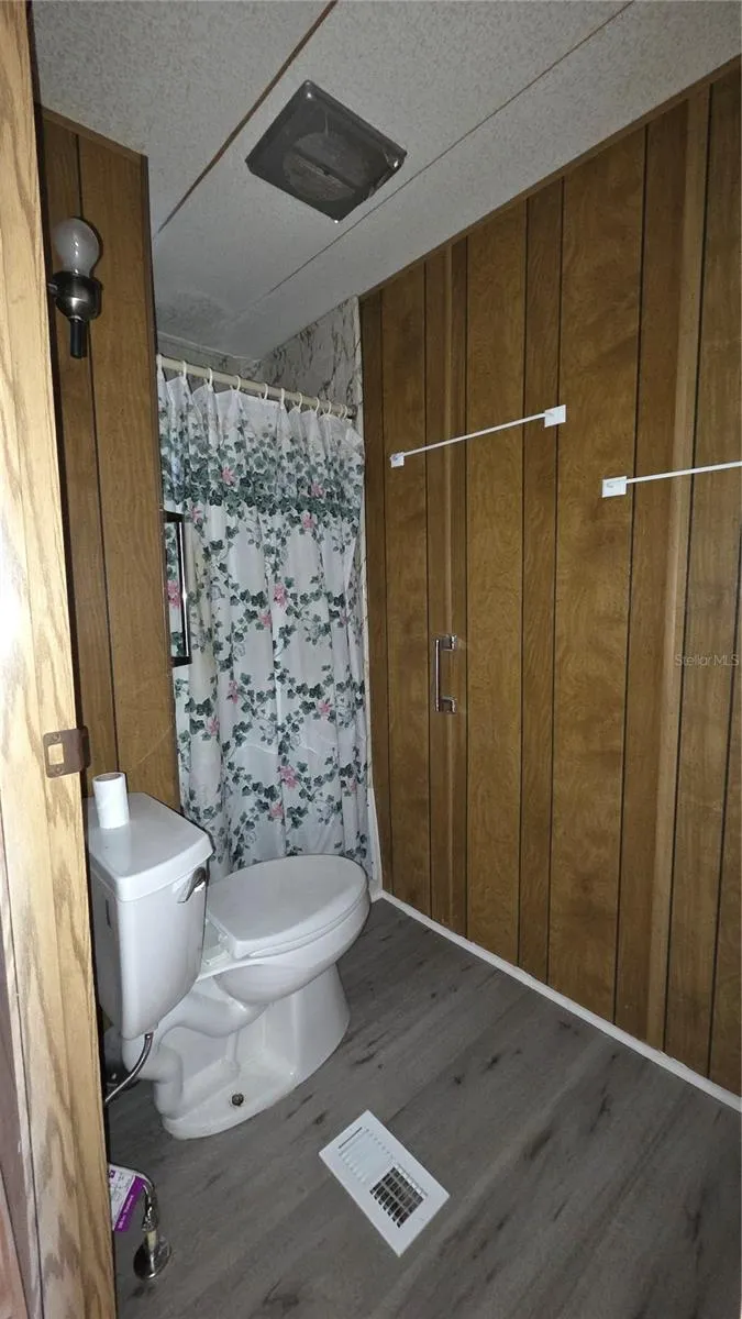 Bathroom with walk-in shower in primary bedroom