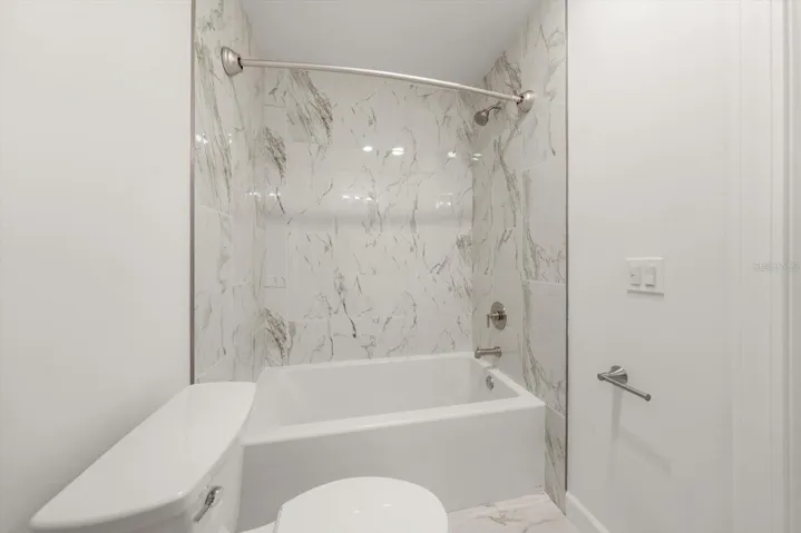 Primary bathroom with new tub and tile