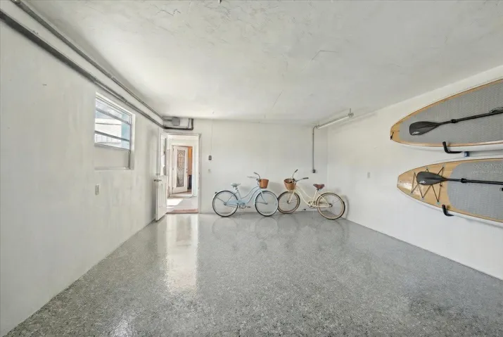1 car garage - virtually staged floor, laundry room in the garage