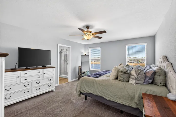 Primary Bedroom with upgraded ceiling fan