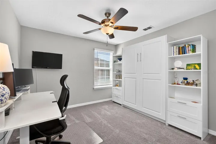 Bedroom 4 features upgraded ceiling fan.