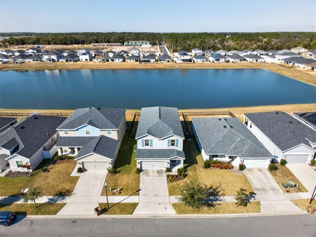 Aerial highlights no rear neighbors.  Backs to pond