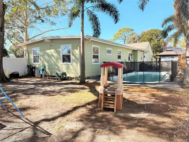 Double doors enter into the backyard.  Great for boat or RV storage.