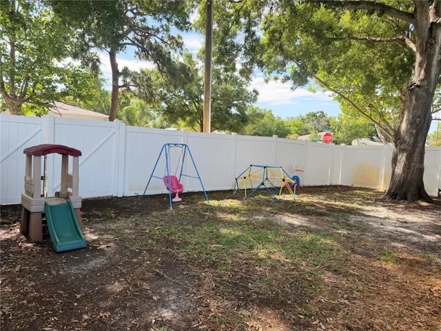 Big fenced in backyard for all your play toys