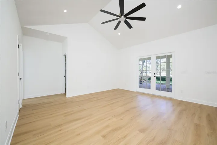 Primary Primary Suite with French doors to covered lanai overlooking golf course.Suite.