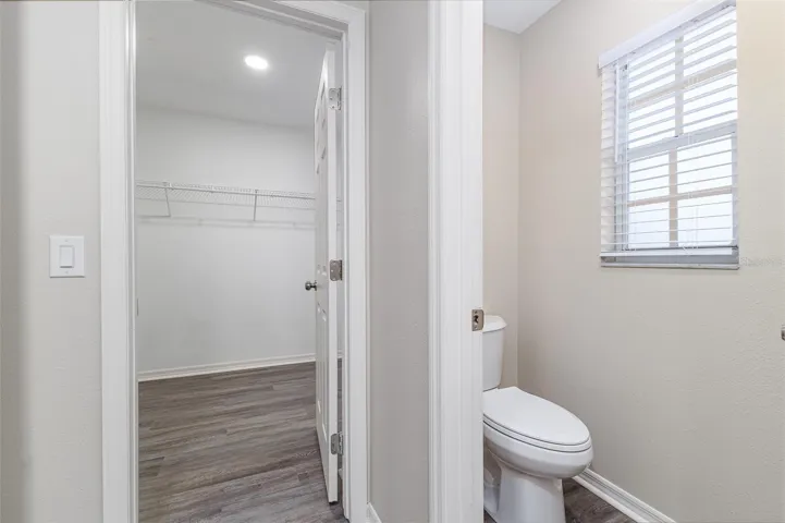 Walk-in-Closet entrance off of en-suite bathroom; separate water closet / toilet room.