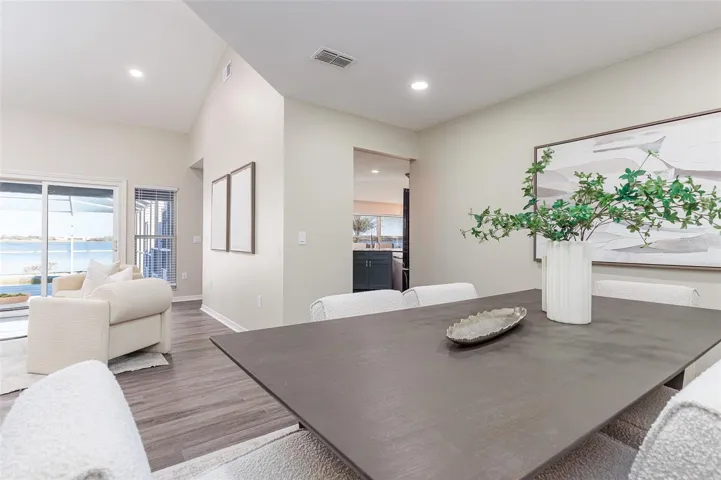 Dining Room off kitchen and living room with Lake Agnes and Pool View