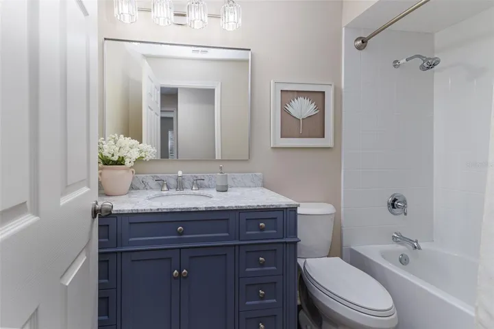 Hall Bathroom with Marble Top; Elongated Toilet, Tub with Shower