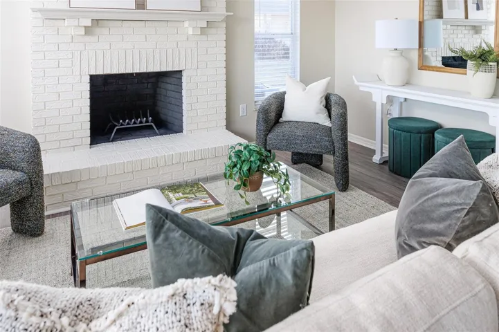 Cozy Family Room with Wood Burning Fireplace with Lake Views