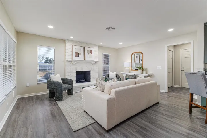 Family Room with Wood Burning Fireplace with Lake Views