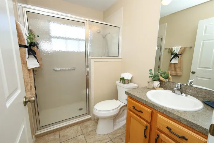 Secondary bathroom with walk in closet