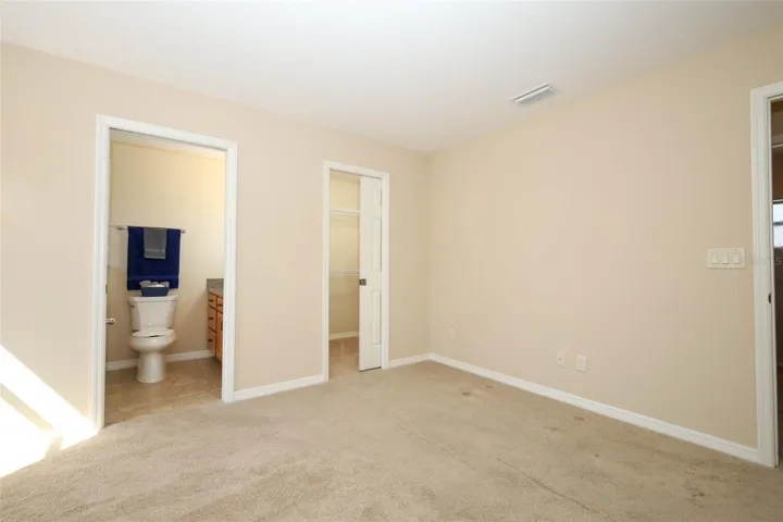 Primary Bedroom with walk-in closet and en-suite bathroom