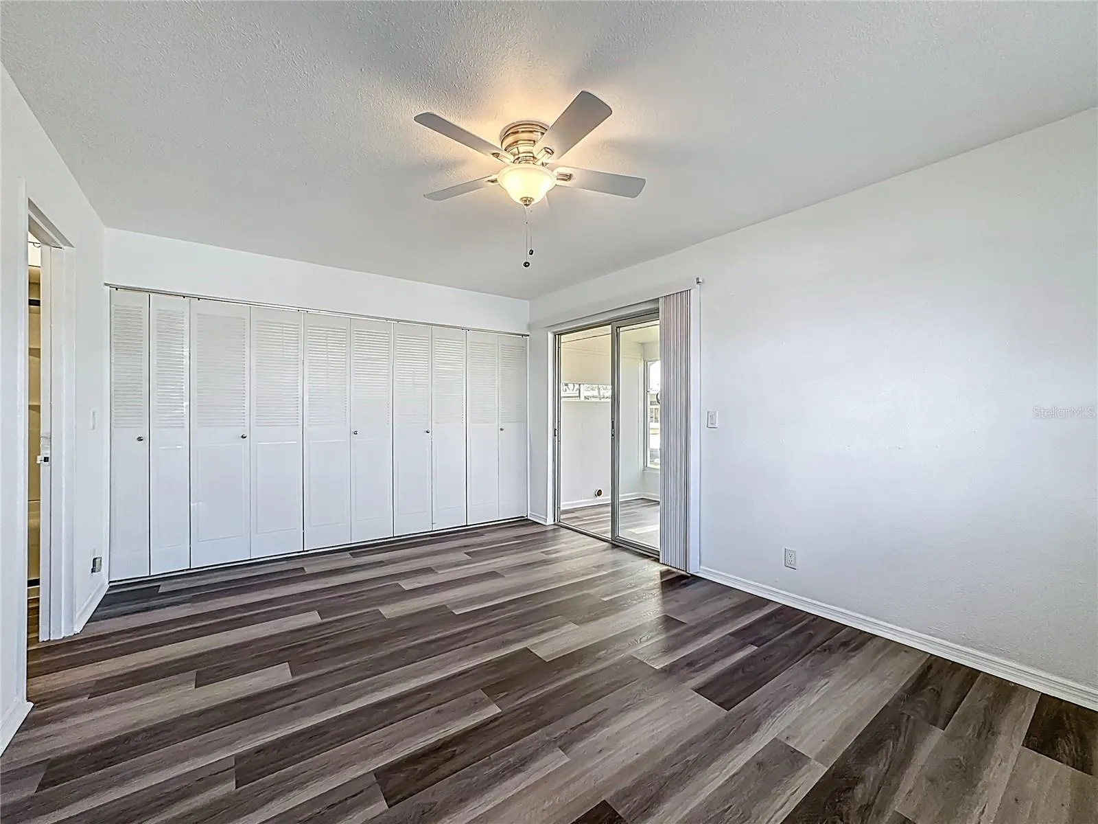 BEDROOM.  SLIDERS TO FLORIDA ROOM