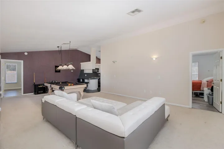 Second level, Family room / loft with full-kitchen and balcony.