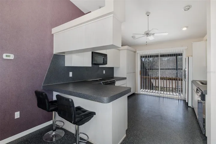 Second level, full-kitchen with balcony.