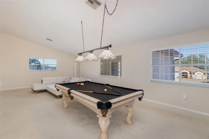 Second level, Family room / loft with full-kitchen and balcony.
