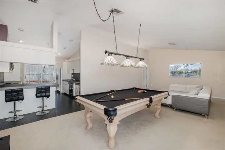 Second level, Family room / loft with full-kitchen and balcony.