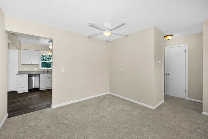 From dining area looking into the kitchen with the lake view THROUGH NEW WINDOWS!!! To the right is the master bedroom, two closets, a full bath and linen closet!