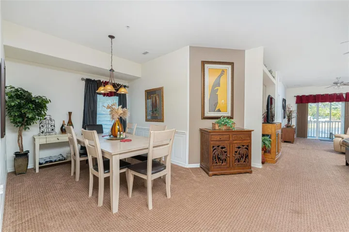Dining room has a beadboard wall as a decorative accent!