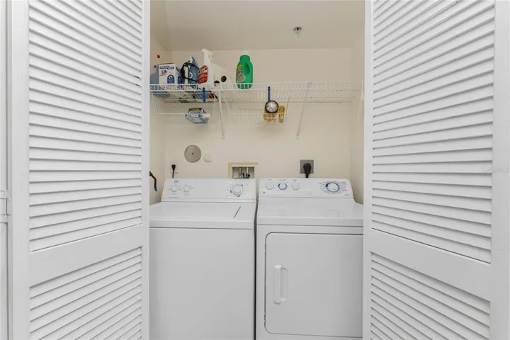 Washer and dryer are tucked away in the laundry closet.