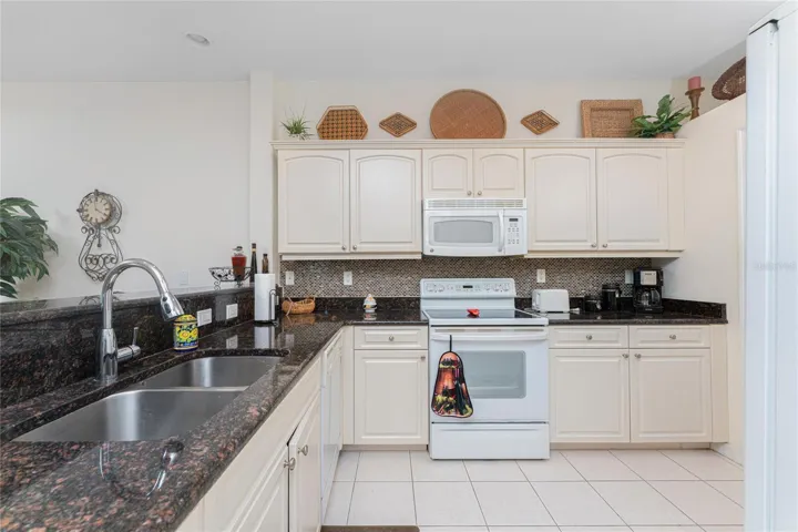 Kitchen has raised face cabinetry and granite top!