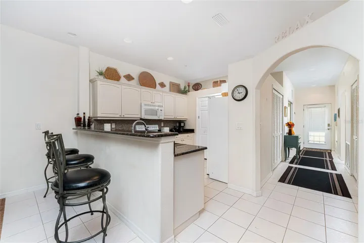 Kitchen has breakfast bar for extra seating!
