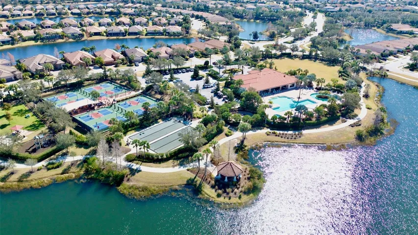Pickleball courts, second pool and fitness. Beautiful drive through community.